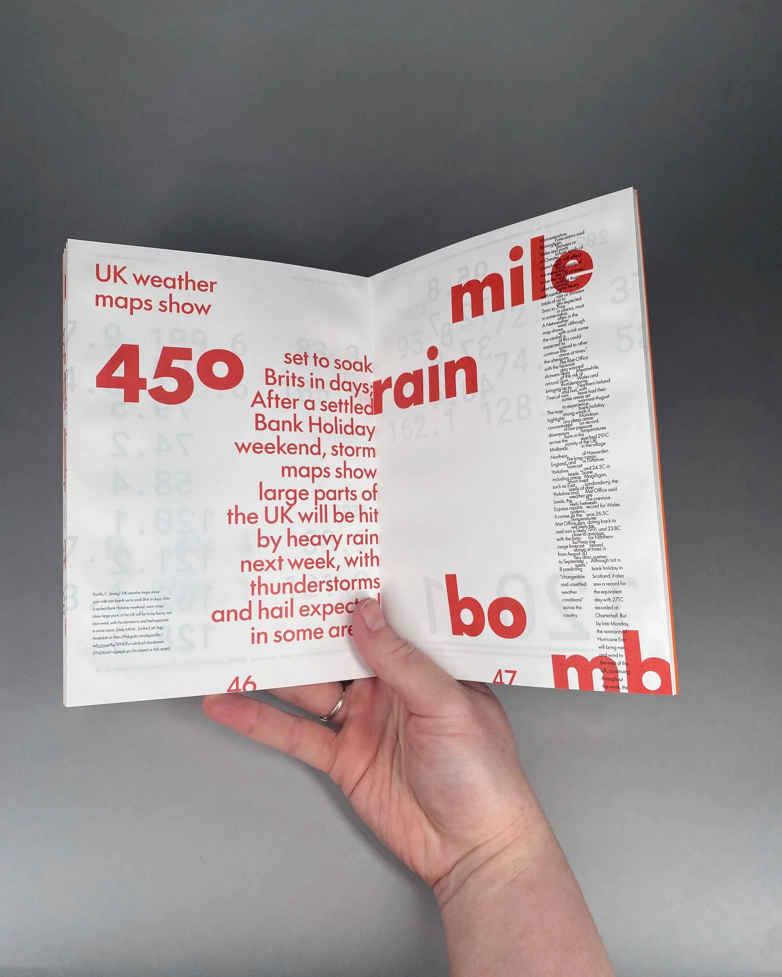 A person holding an open magazine showing a weather report about the UK, with large red numbers and some small paragraphs of text.