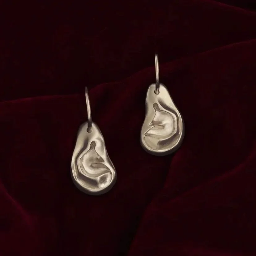 Ear-shaped silver earrings with hoops 