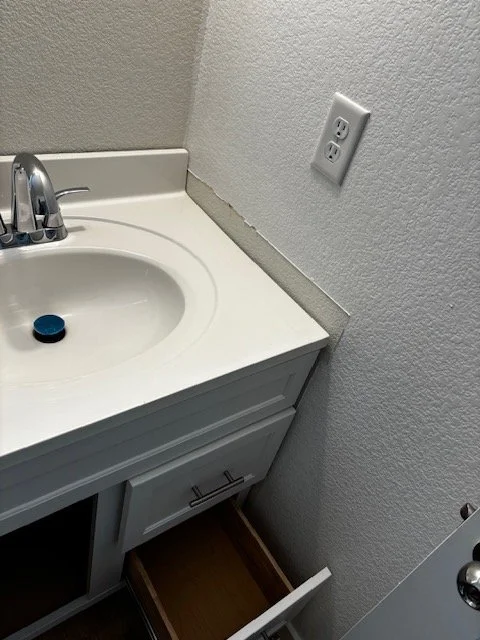 Patching and painting during vanity installation