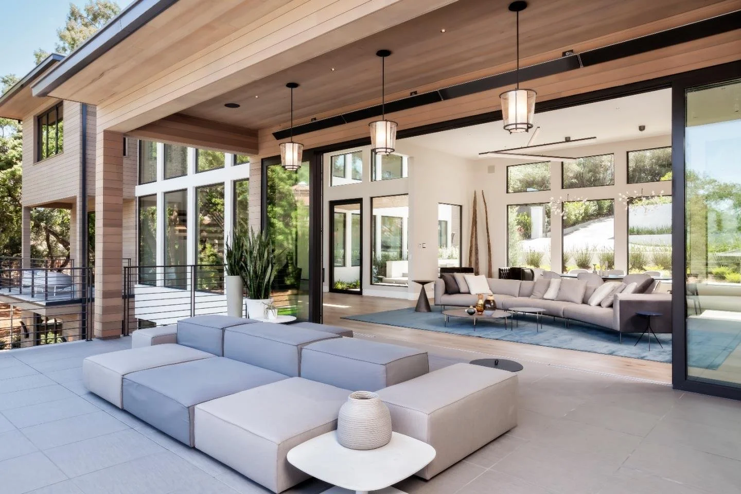 Modern luxury home interior with open living space and floor-to-ceiling windows