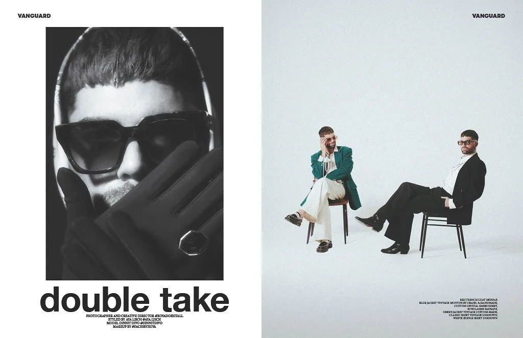 A magazine spread featuring fashion photography with the title "double take." The left page shows a black-and-white close-up of a person wearing large sunglasses, gloves, and a ring, with a hand partially covering their face. The right page depicts two men sitting on chairs against a plain white background, one in a teal blazer and beige pants, talking on the phone, and the other in a black suit and white shirt, looking at the camera.
