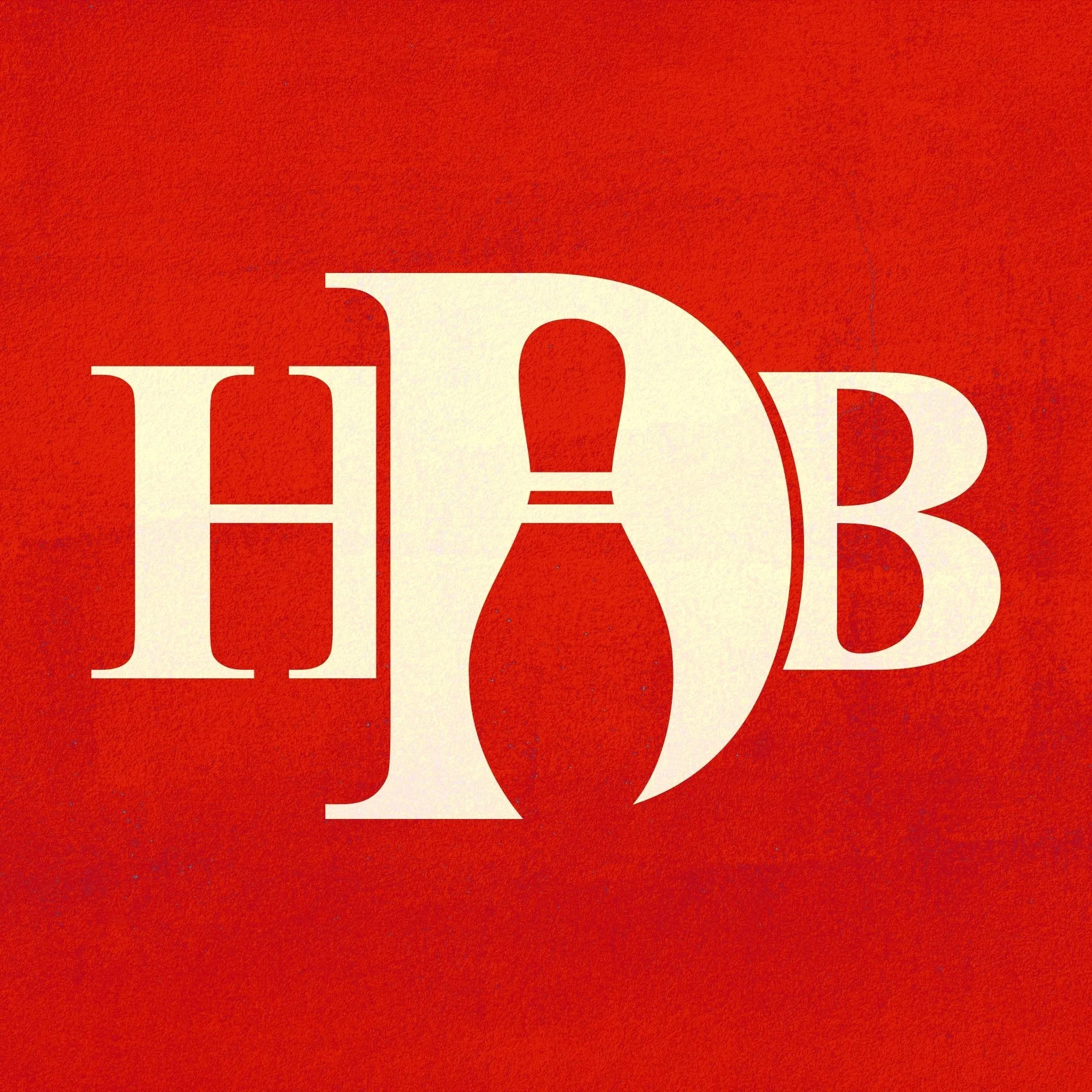 Close-up of a red background with partial large white letters visible at the bottom.