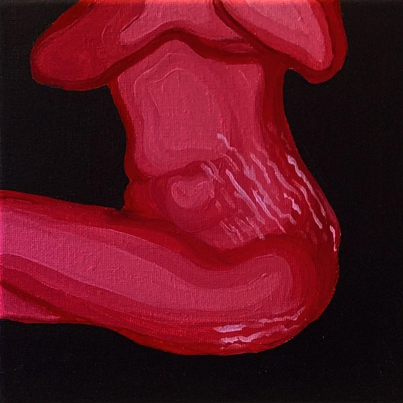 Close-up of a red abstract painting on black background.