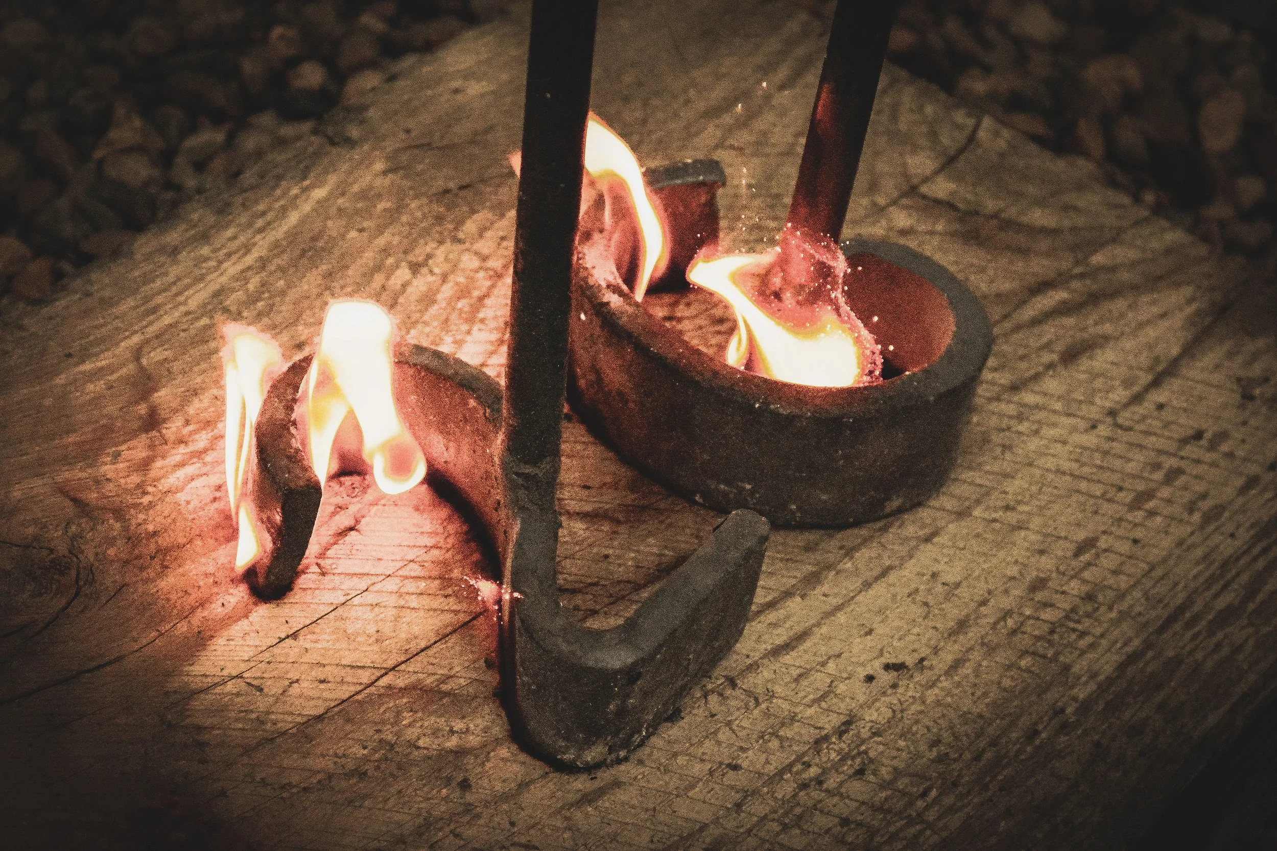 2G ranch brand being burned into wood