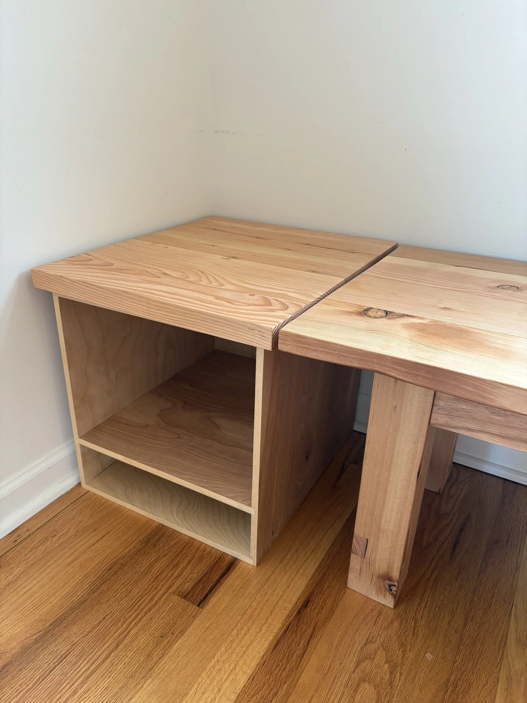 Detail of the breakfast nook bench and its bookshelf cubbies.