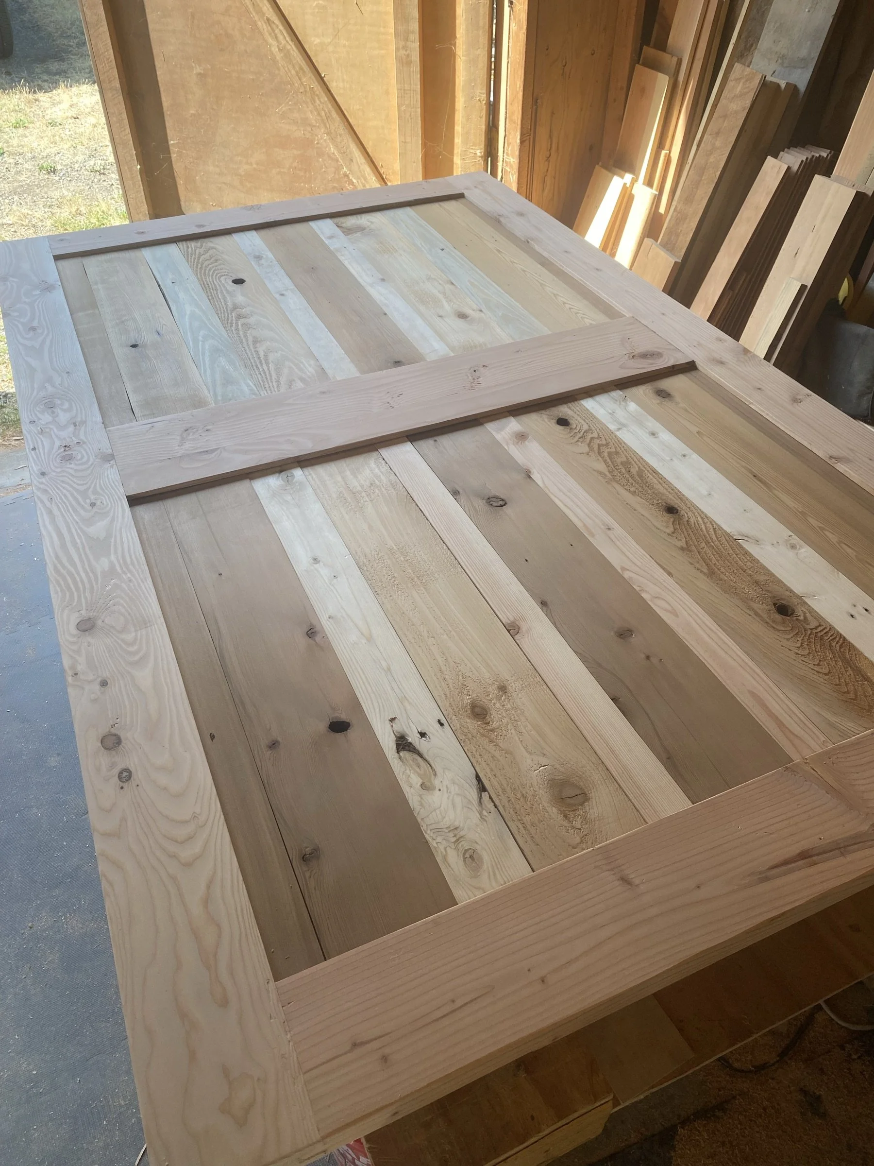 A reclaimed-plank barn door in progress.