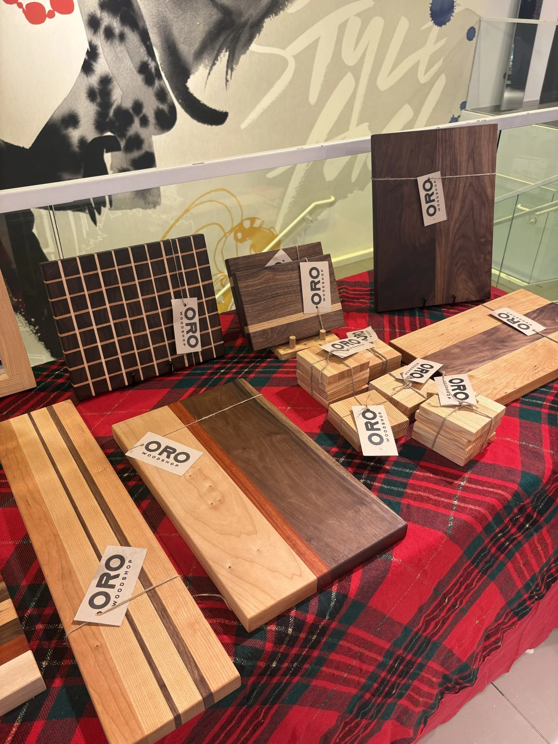 Oro Woodshop's market booth display of cutting boards.