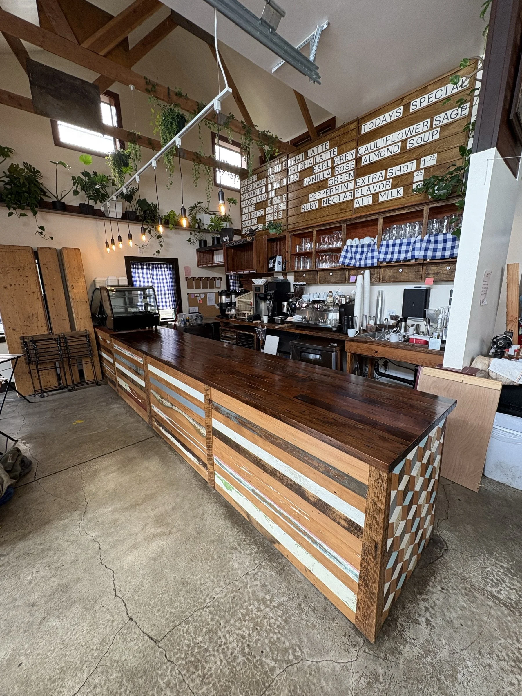 The 13-foot reclaimed-fir bar top running along the wall at Fressen Artisan Bakery.