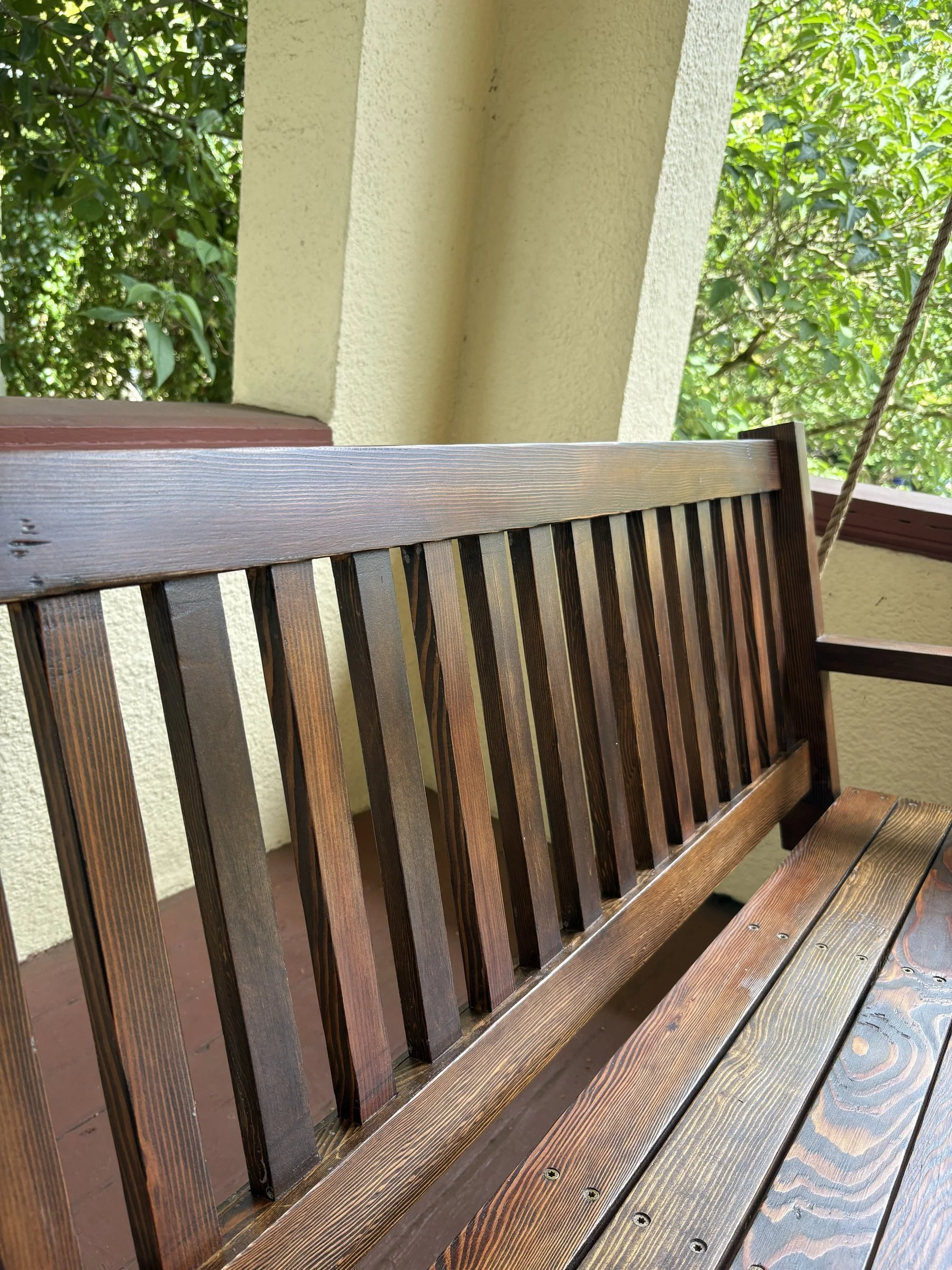 Detail of the slatted back on the reclaimed-fir porch swing.
