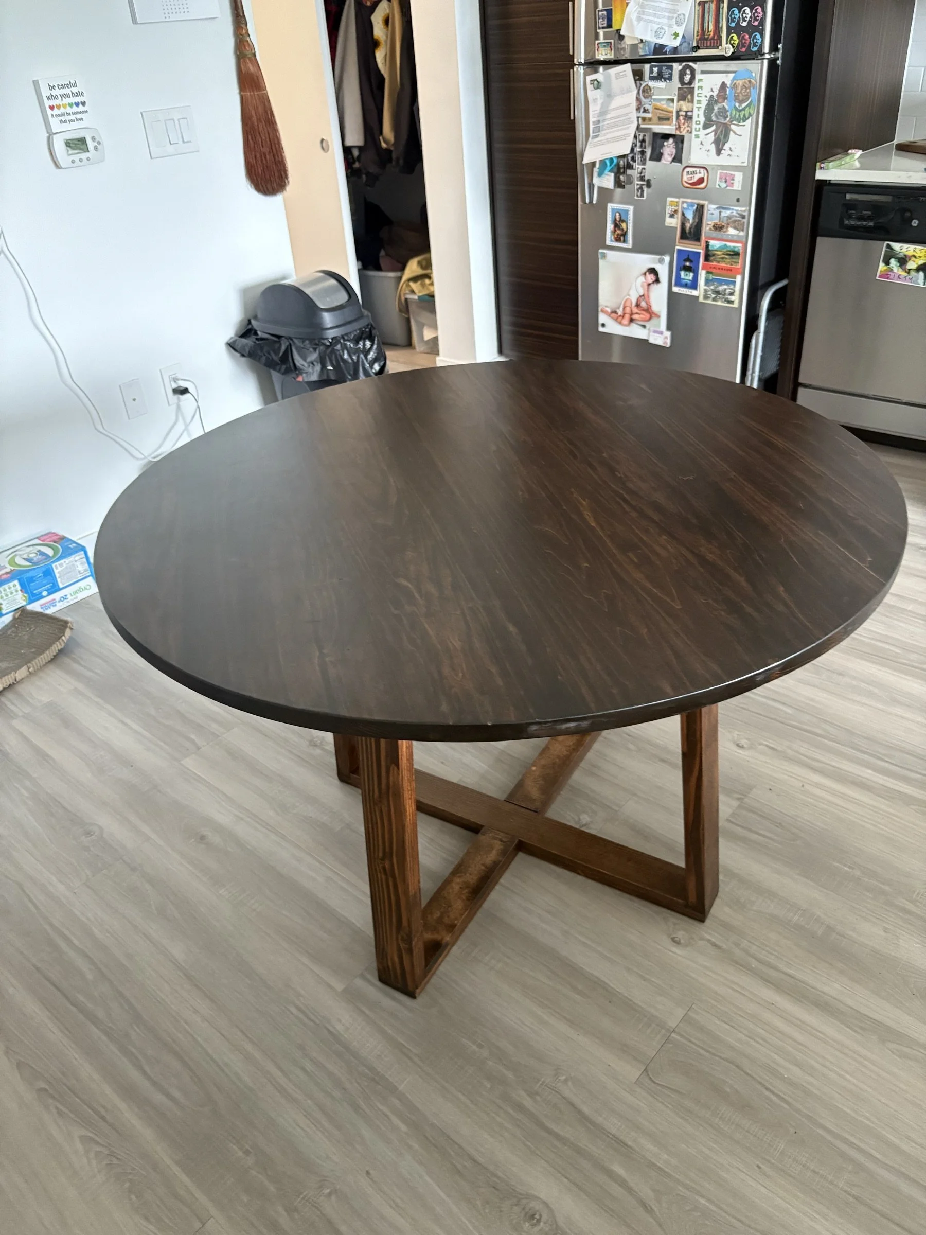 The full round table with a poplar top in a kitchen.