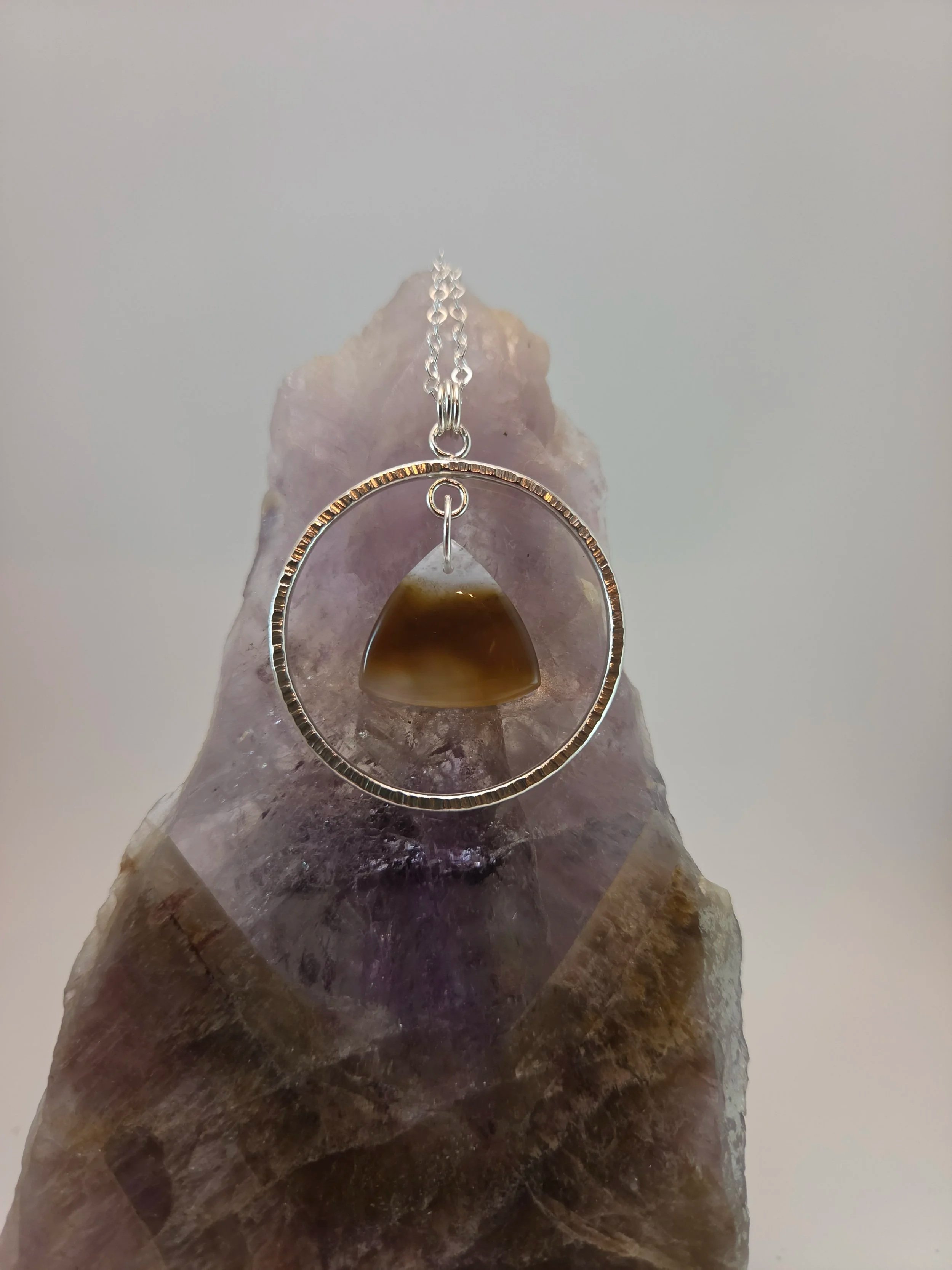 Montana agate circular sterling silver pendant