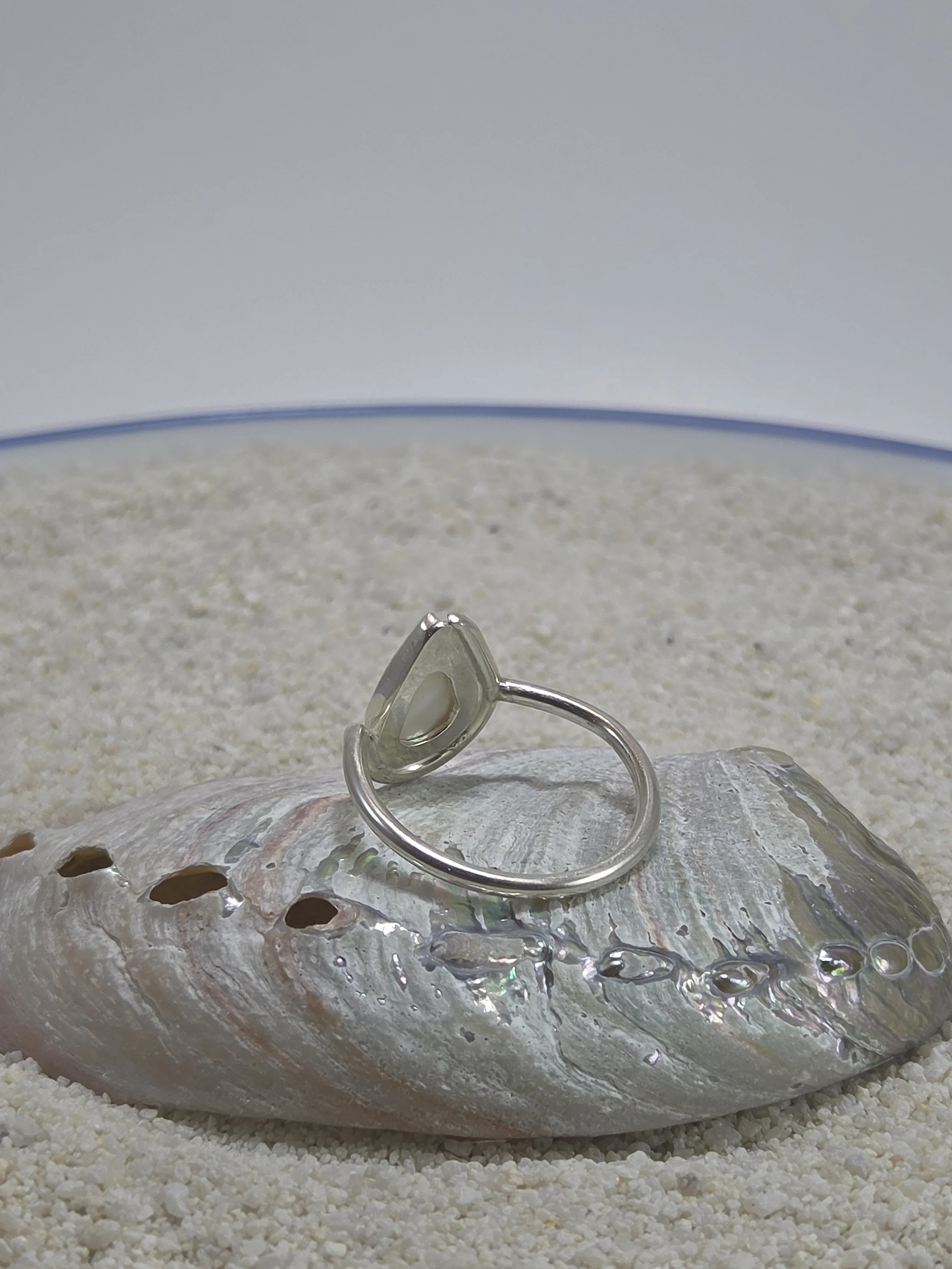 Pear shaped mother of pearl set in a sterling silver ring