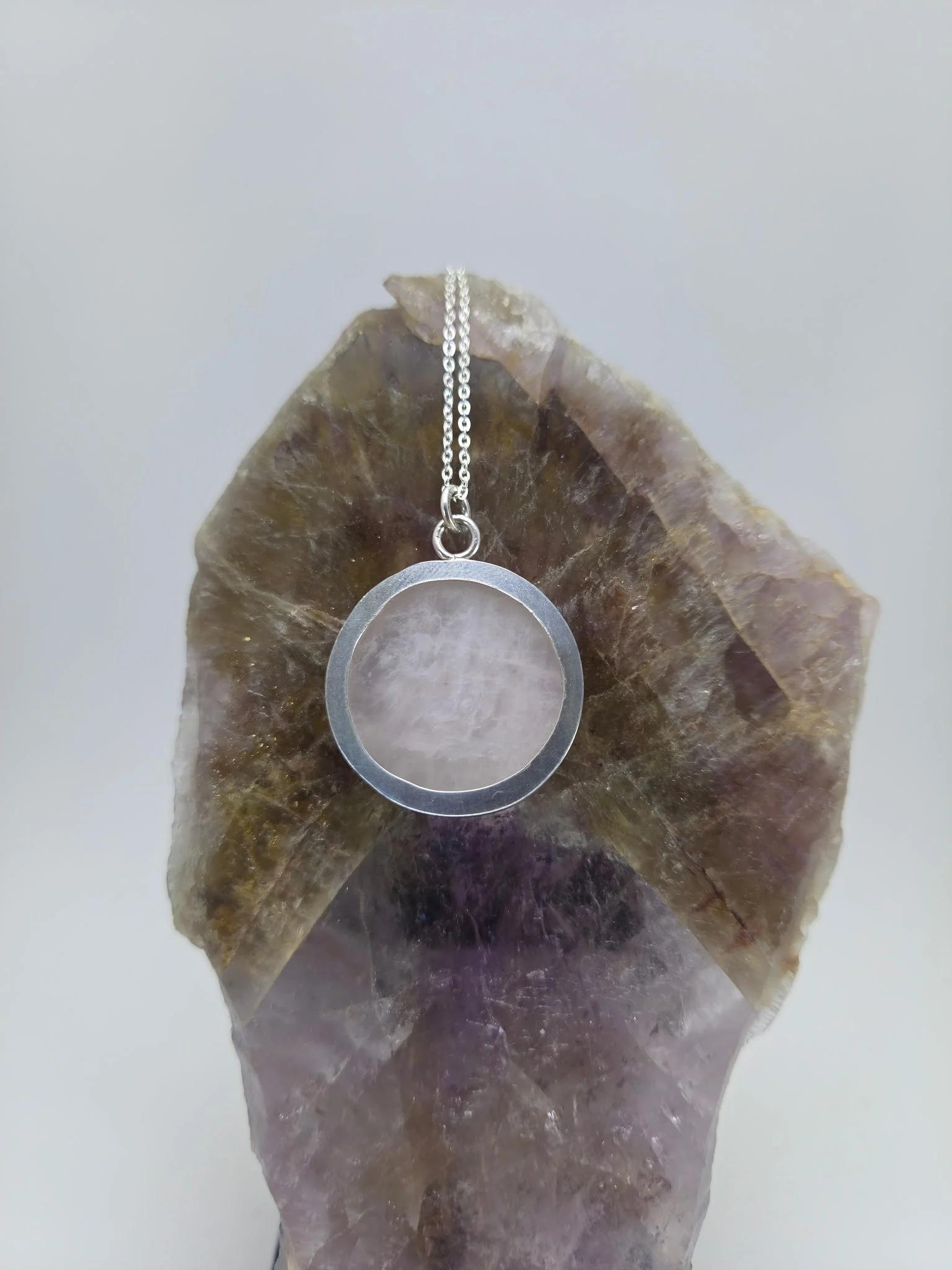 Back of rose quartz pendant with sterling silver