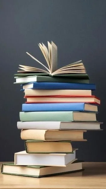 Stack of hardcover and paperback books with an open book on top, against a dark gray background.