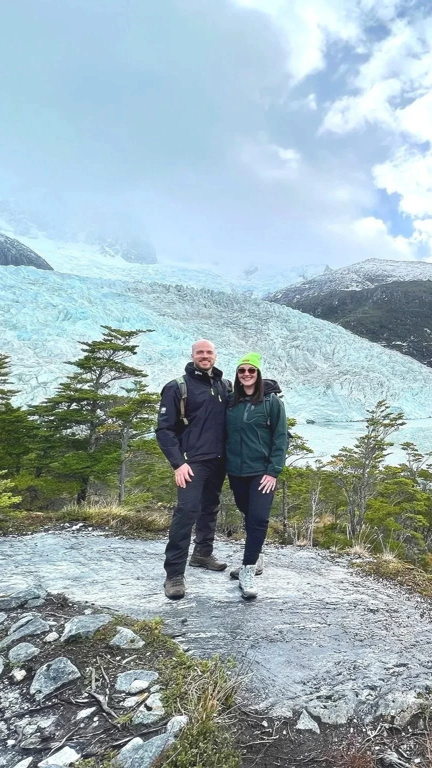 Young couple at Pia Glacier in Patagonia, Chile.