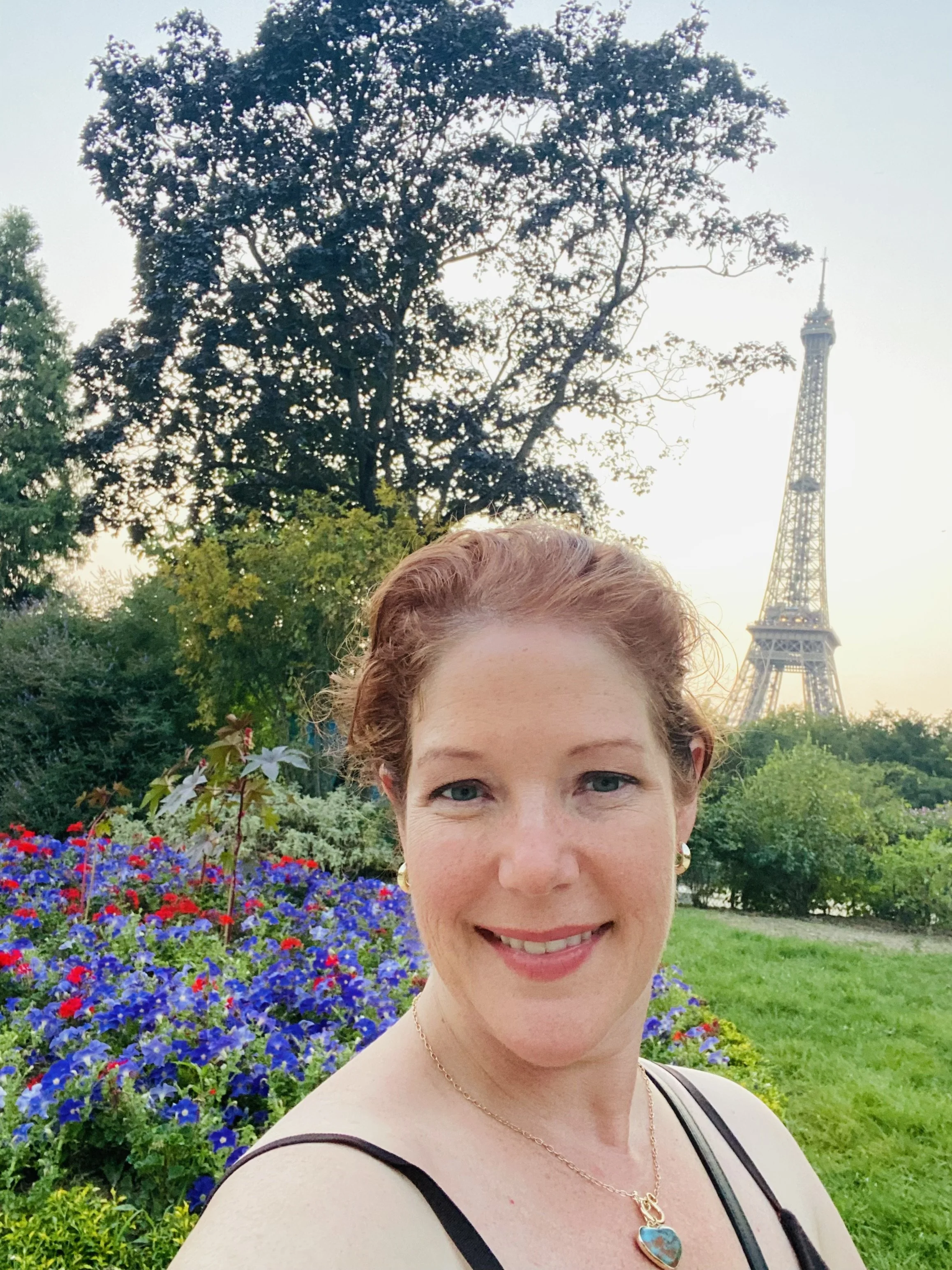 Amanda Bacqué at Champ de Mars park in Paris with the Eiffel Tower in the background August 2025.