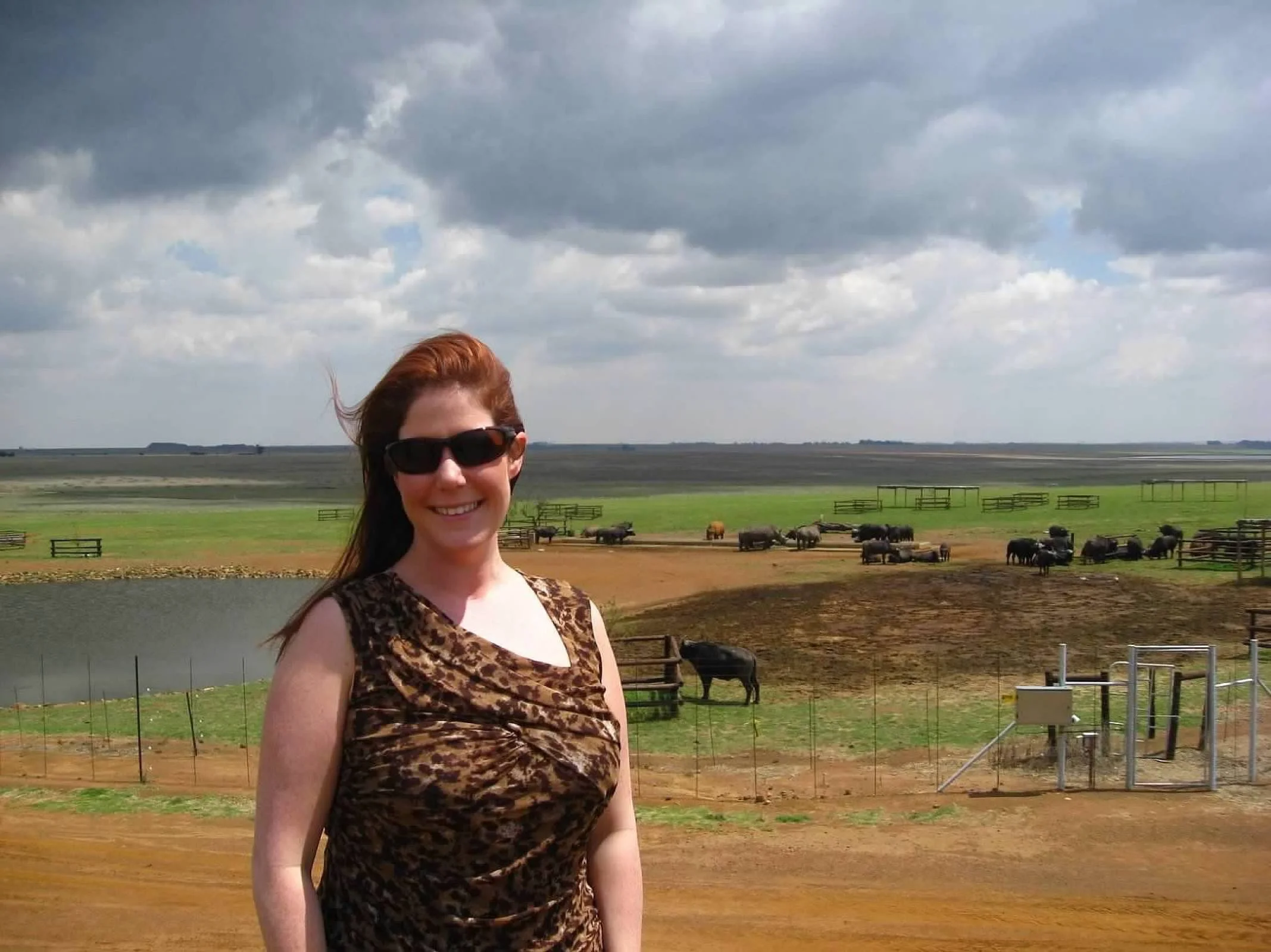 Amanda Bacqué at a roadside stop in South Africa with wilderness landscape in the background October 2012.