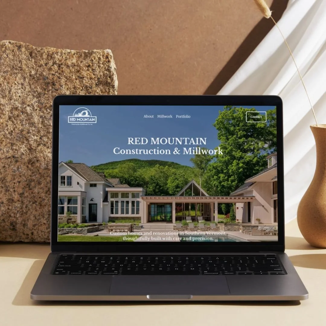 Laptop showing the Red Mountain Construction & Millwork custom home builder website, built on Squarespace