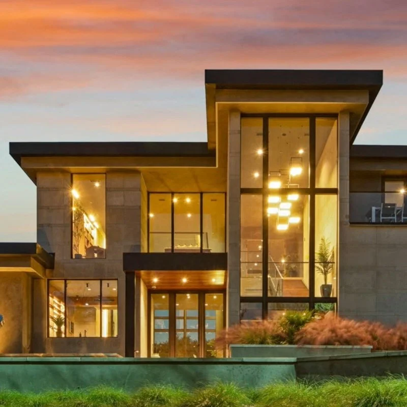 Modern custom-built home at dusk