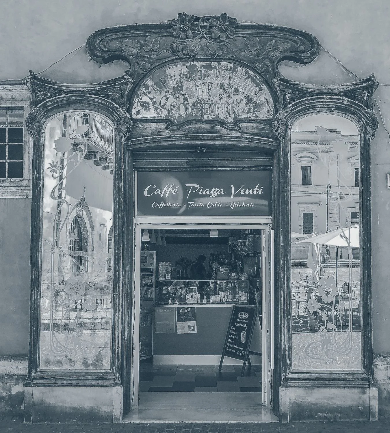 Ornate carved doorway of a small café storefront — website design services for small businesses