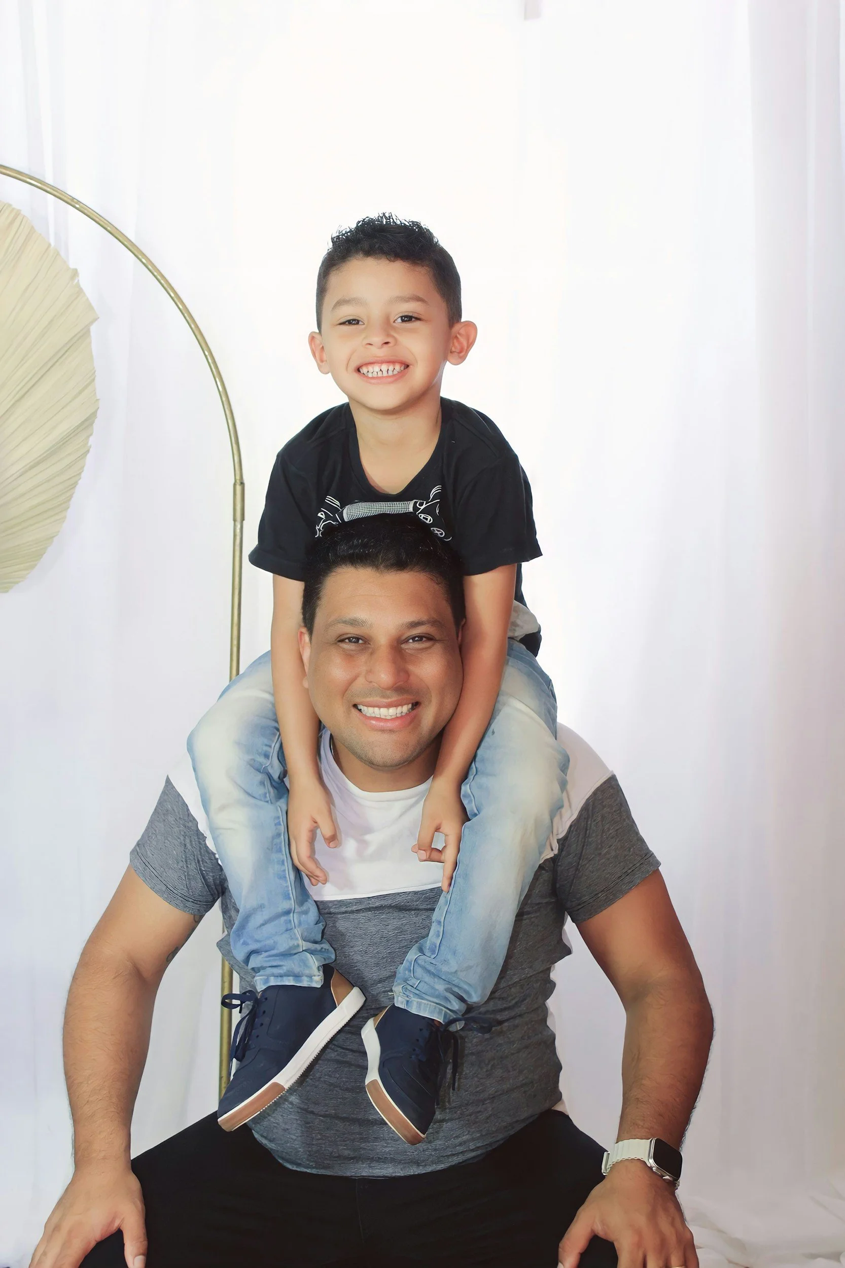 Father and son after their chiropractic appointments at McCue Chiropractic in Dallas, TX, offering personalized family chiropractic care for adults, children, and active families.