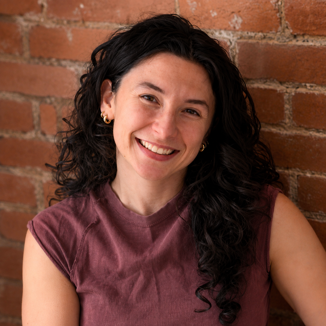 Professional headshot of Dr. McCue, DC, a Dallas, TX chiropractor providing personalized pediatric, adult, sports, and family chiropractic care.