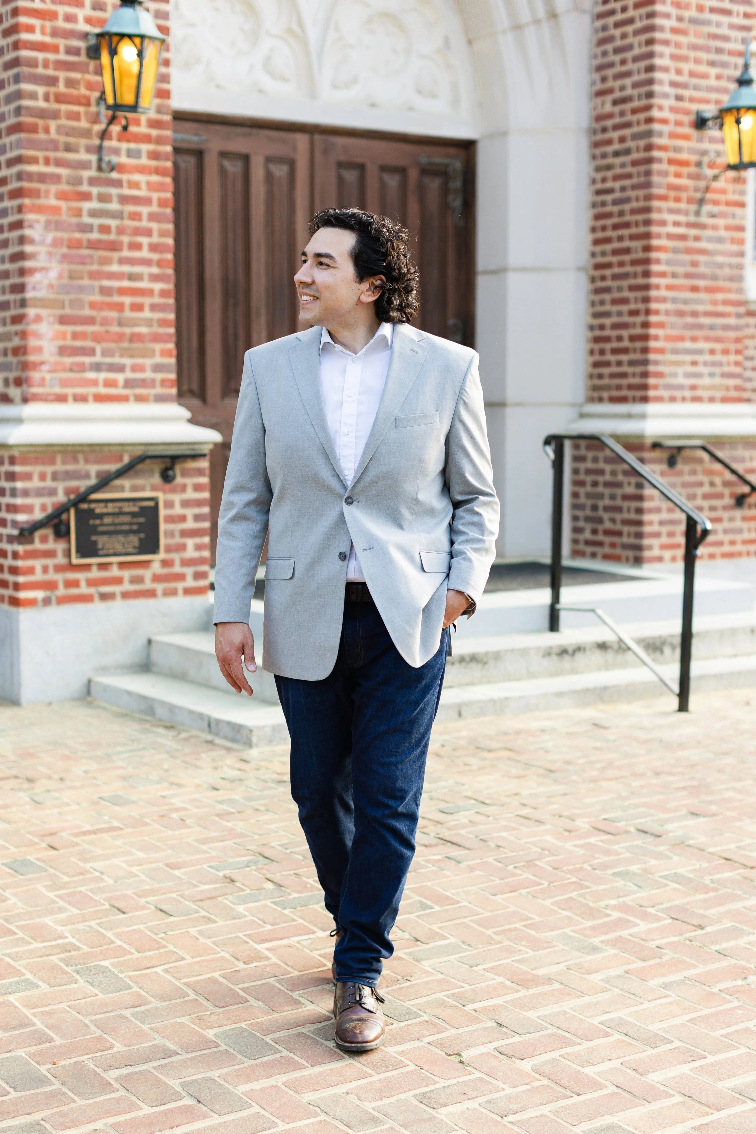 Attorney Nathan Crispo walking in a light gray jacket and blue pants. Nathan represents individuals in criminal defense, misdemeanor, felony, theft, shopliftin, forgery, prostitution, DUI, DWI, expungement, record sealing, and gun rights restoration.