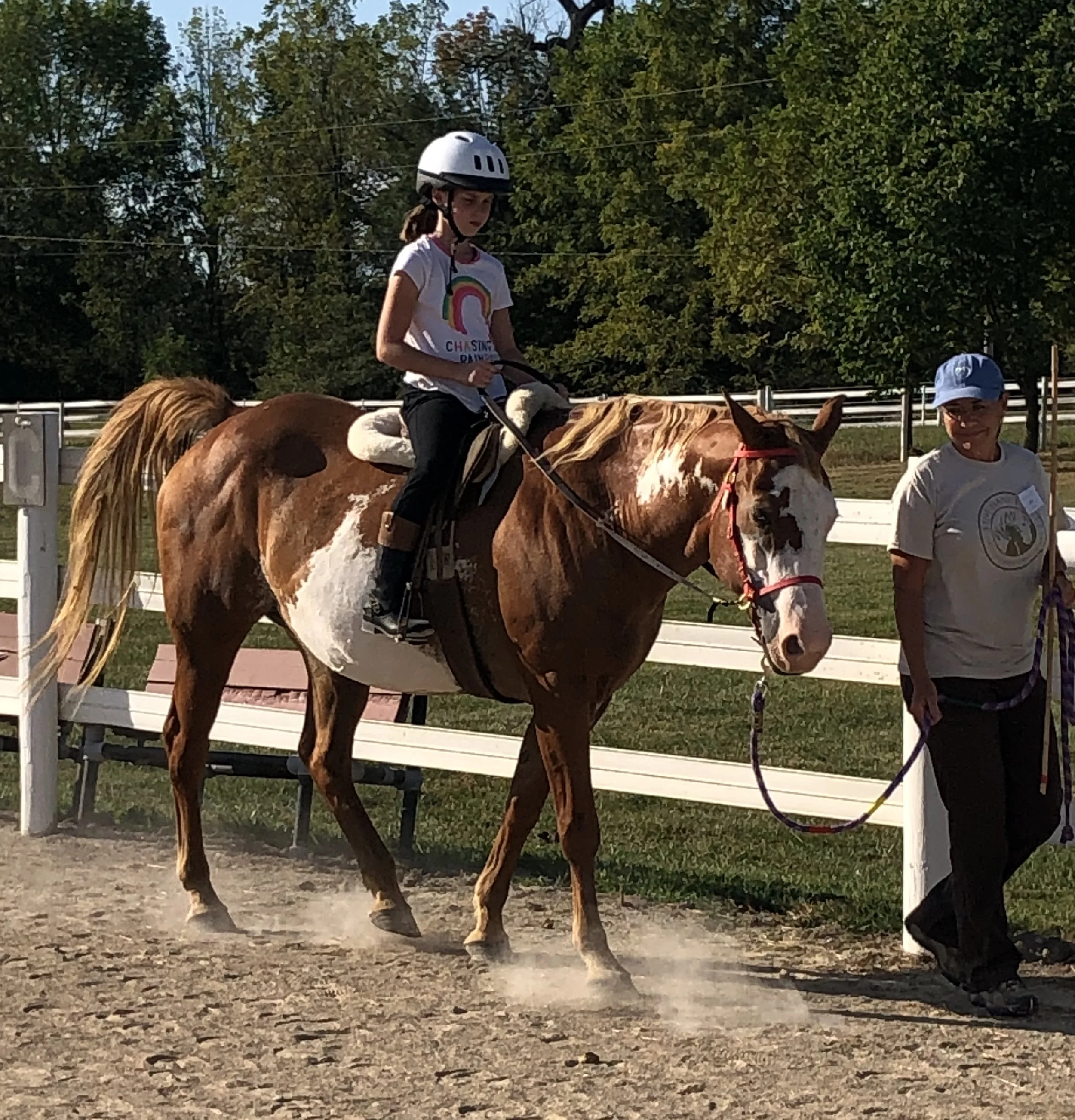 9 year old girl riding paint therapy horse, Daisy