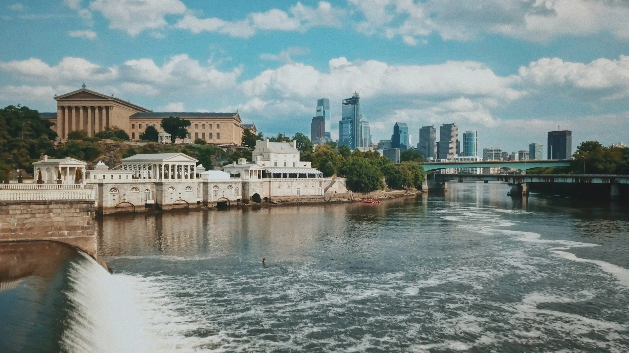View of the Philadelphia skyline and Philadelphia Museum of Art along the Schuylkill River.