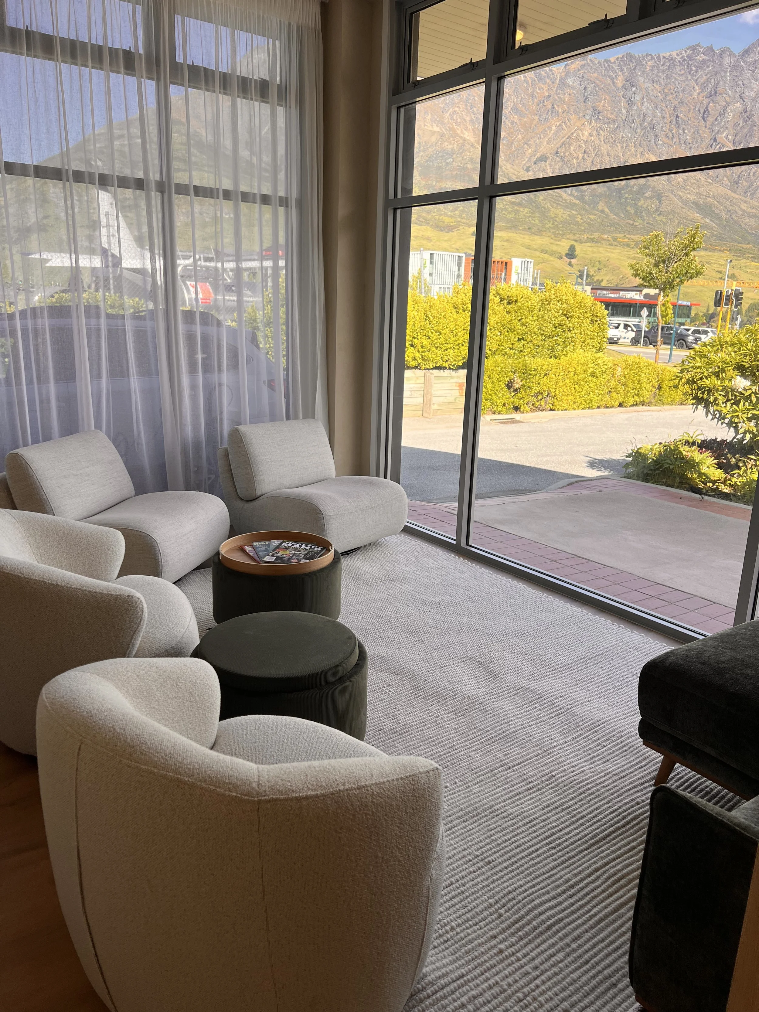 Luxury relaxation lounge at Queenstown Massage inside Indulge Skin & Wellness, where guests unwind before and after their massage.