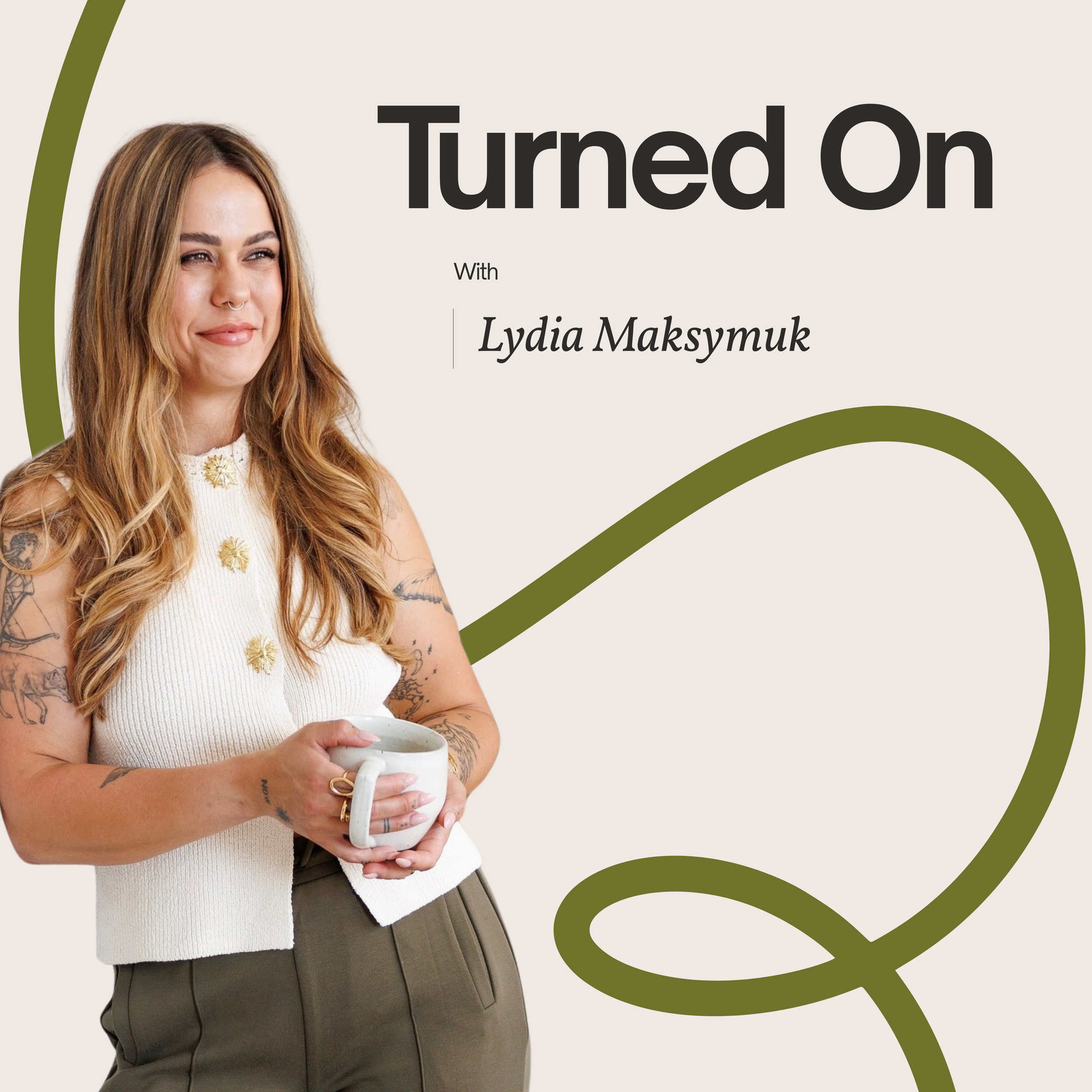 A woman with long wavy hair and tattoos on her arms holding a white mug, dressed in a cream sleeveless top and olive green pants, standing against a light background with green curvy design elements.