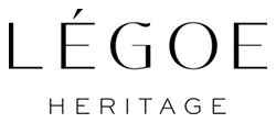 Logo with the words 'LÉGOE HERITAGE' in uppercase letters, with 'LÉGOE' larger and above 'HERITAGE'