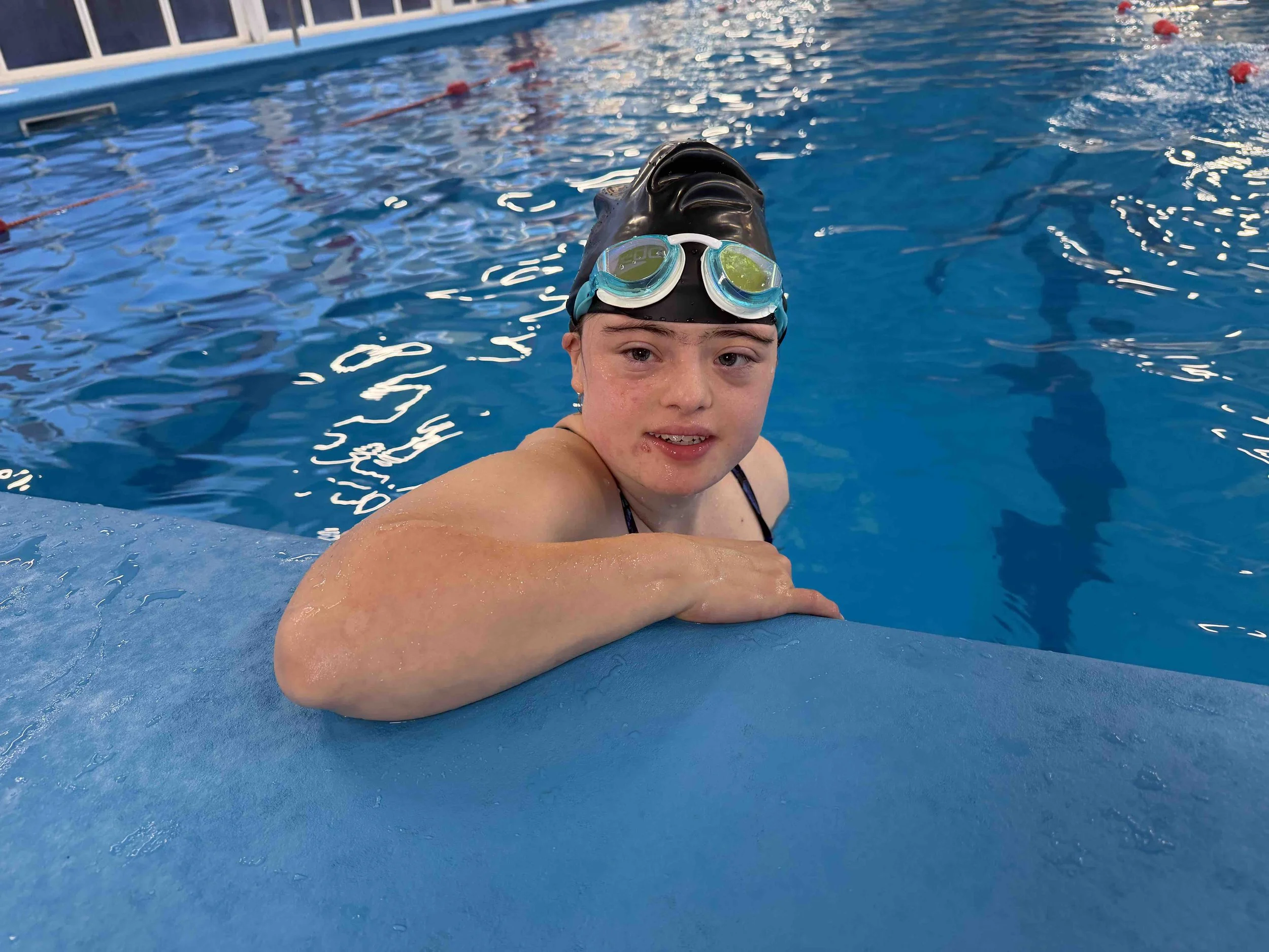 Down syndrome swimmer in the water at The Flipper Club