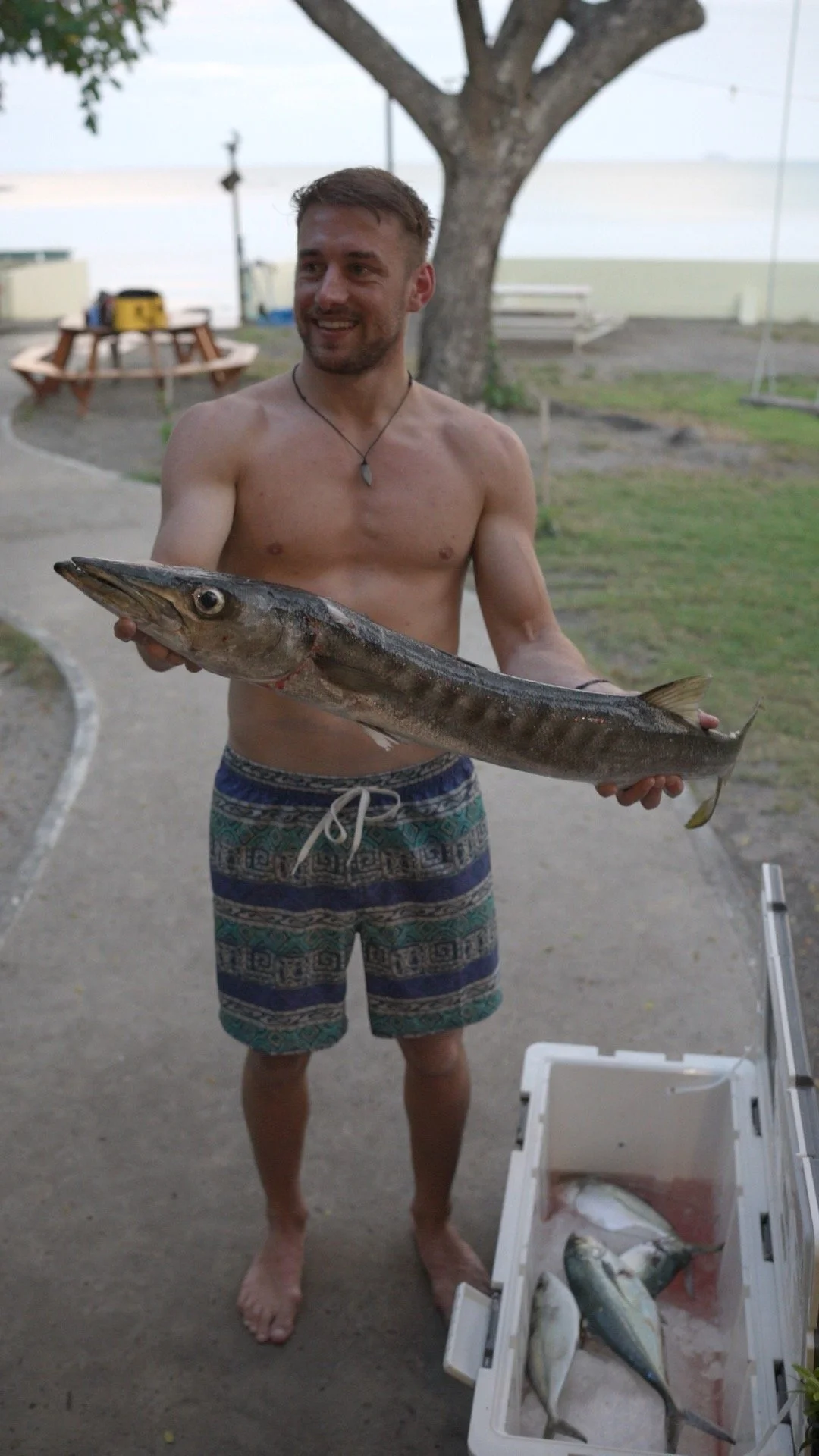 Happy customer with a barracuda caught on a private fishing trip
