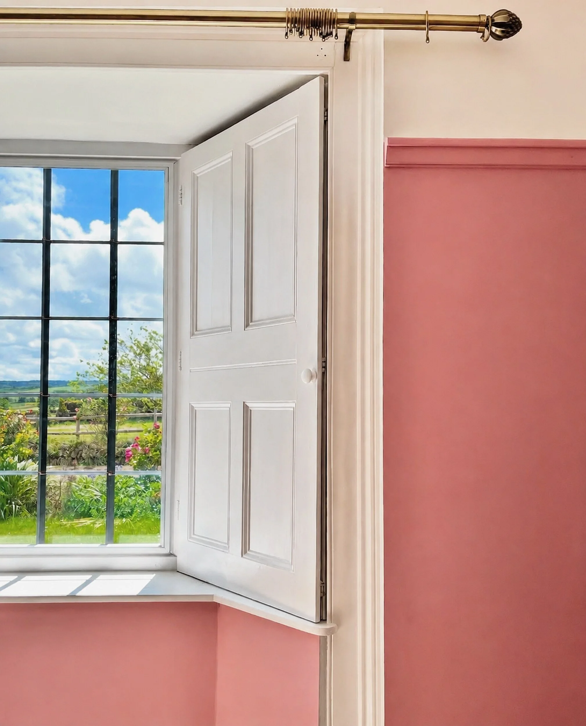 White-painted timber windows framed by soft pink walls.
