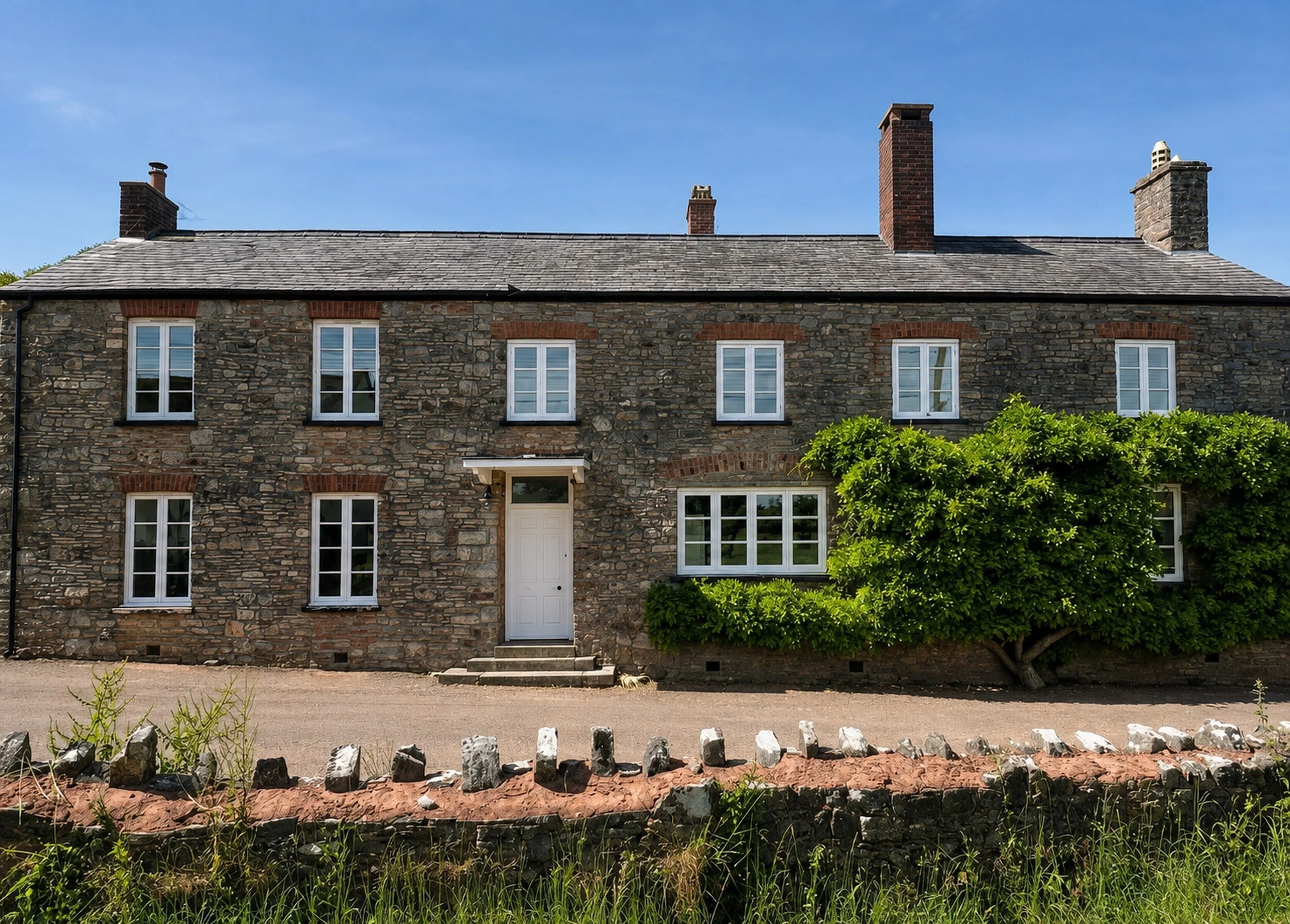 Exterior timber windows and door finished in white oil-based paint, with localised timber repairs.