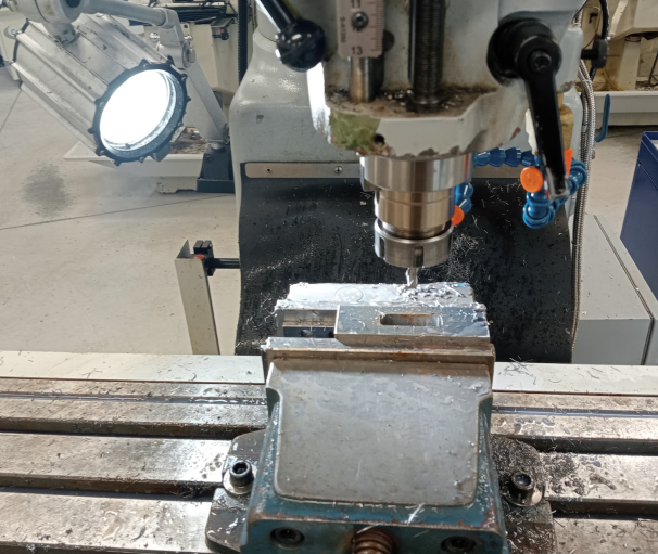 Machining a slot for the tap wrench