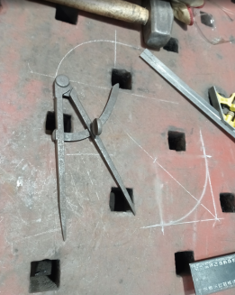 Marking out radii for brackets.