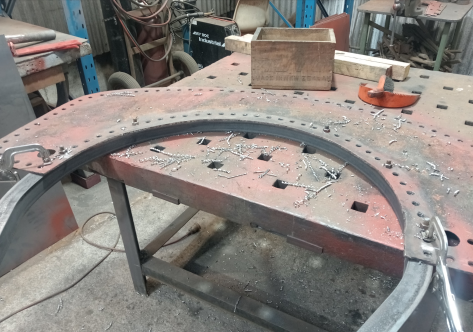 Drilling holes in saddle hoop