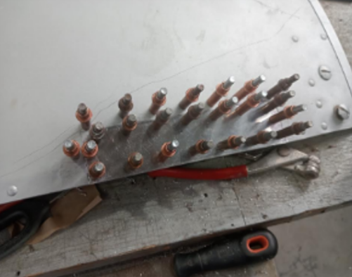 Cutting out and patching corroded areas.