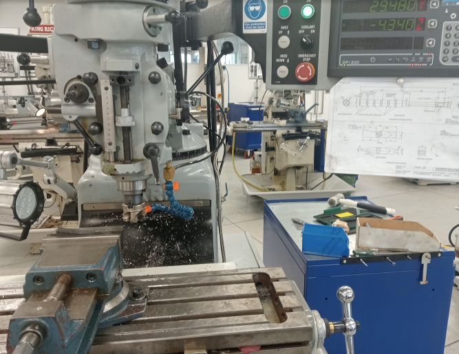 Machining the head for the welding hammer.