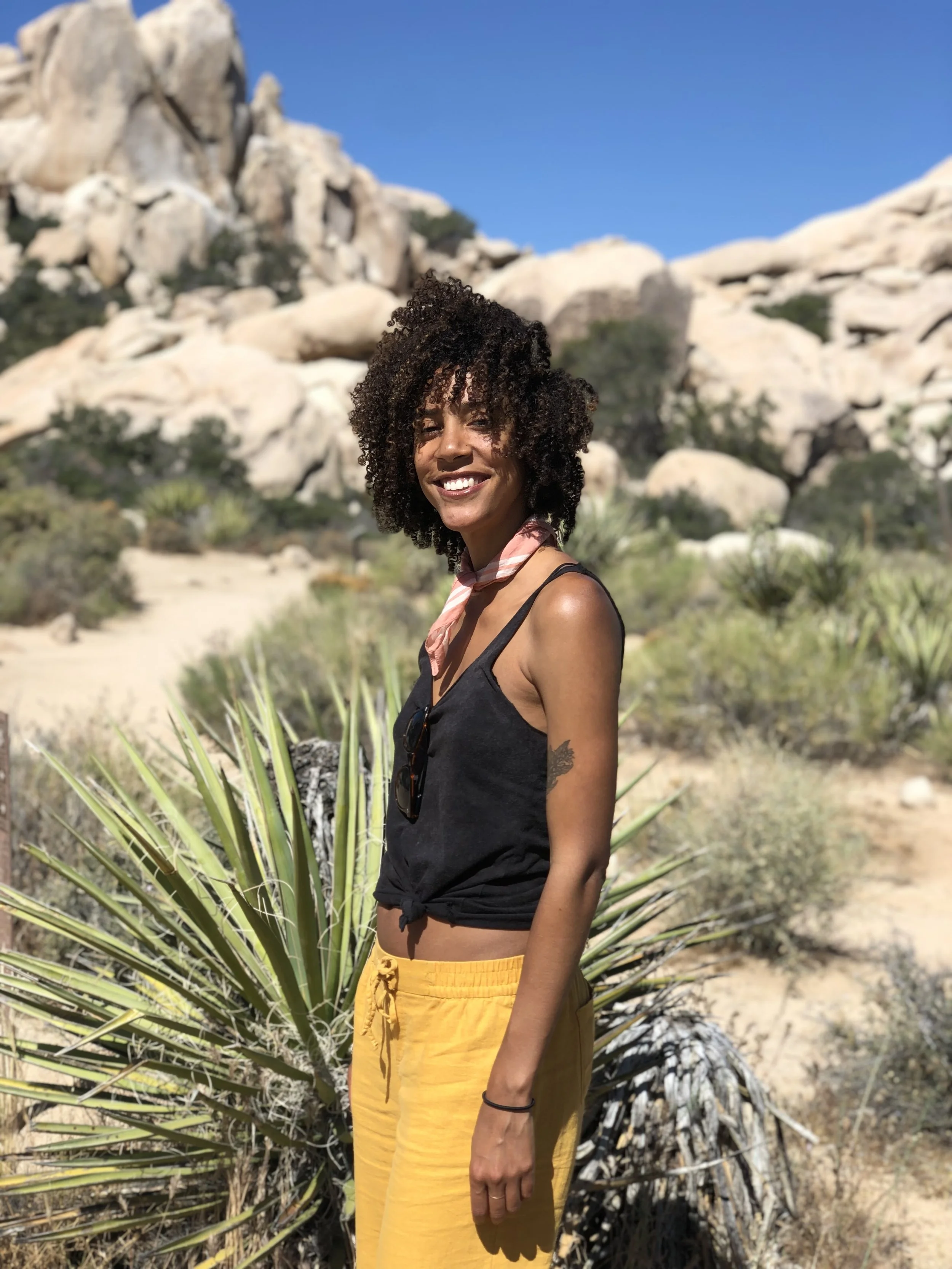 Danielle smiling, while on a hike in Joshua Tree