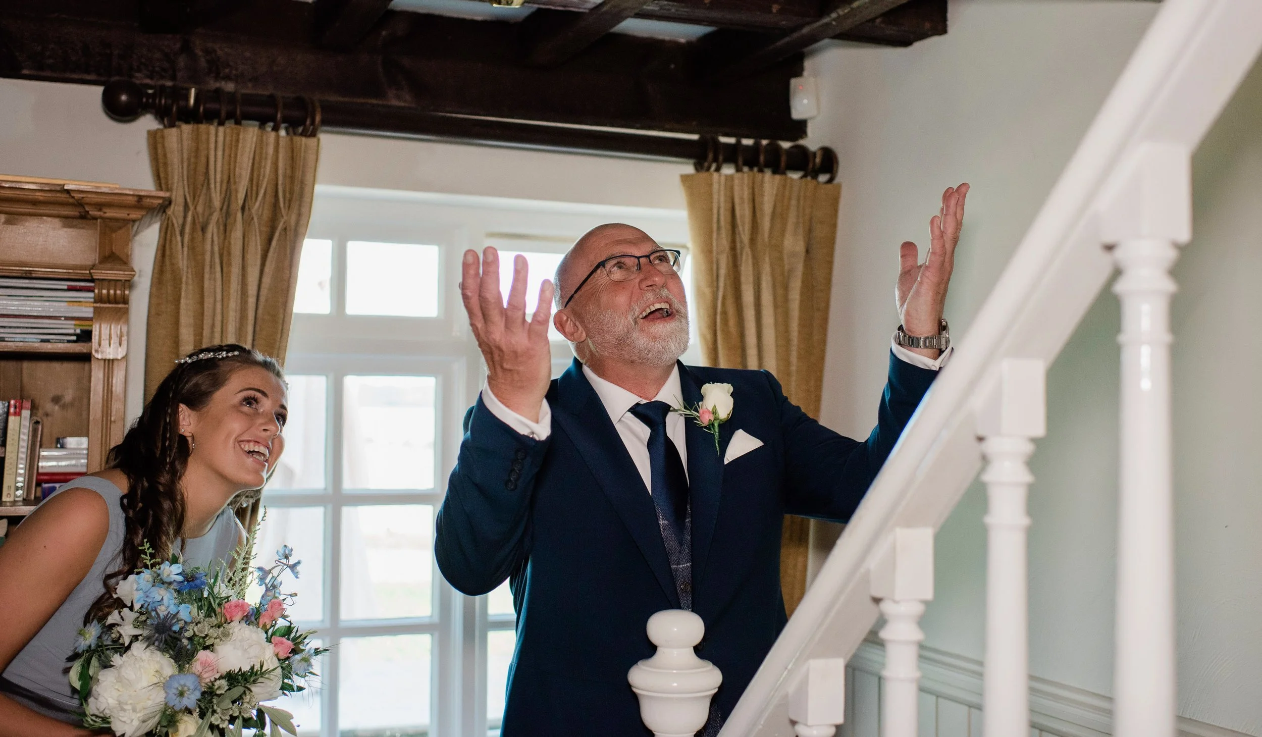 father of the bride seeing his daughter in her wedding dress in Stockholm, Sweden