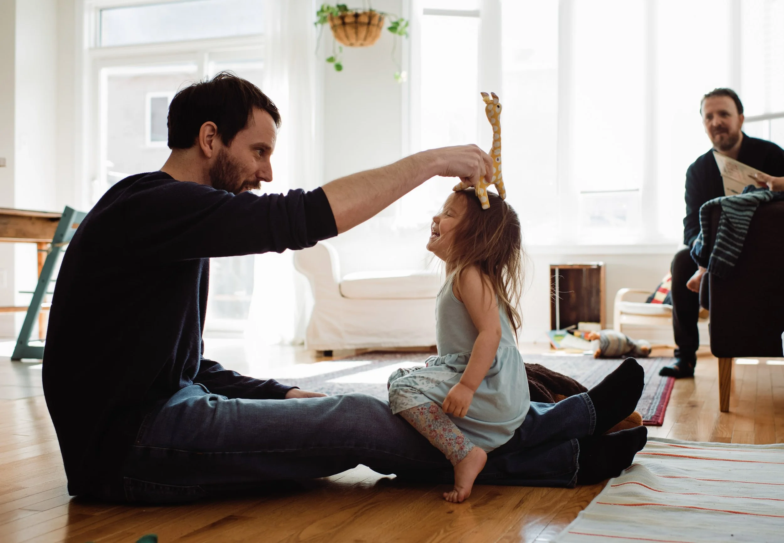 dad playing with his daughter family at home photography stockholm