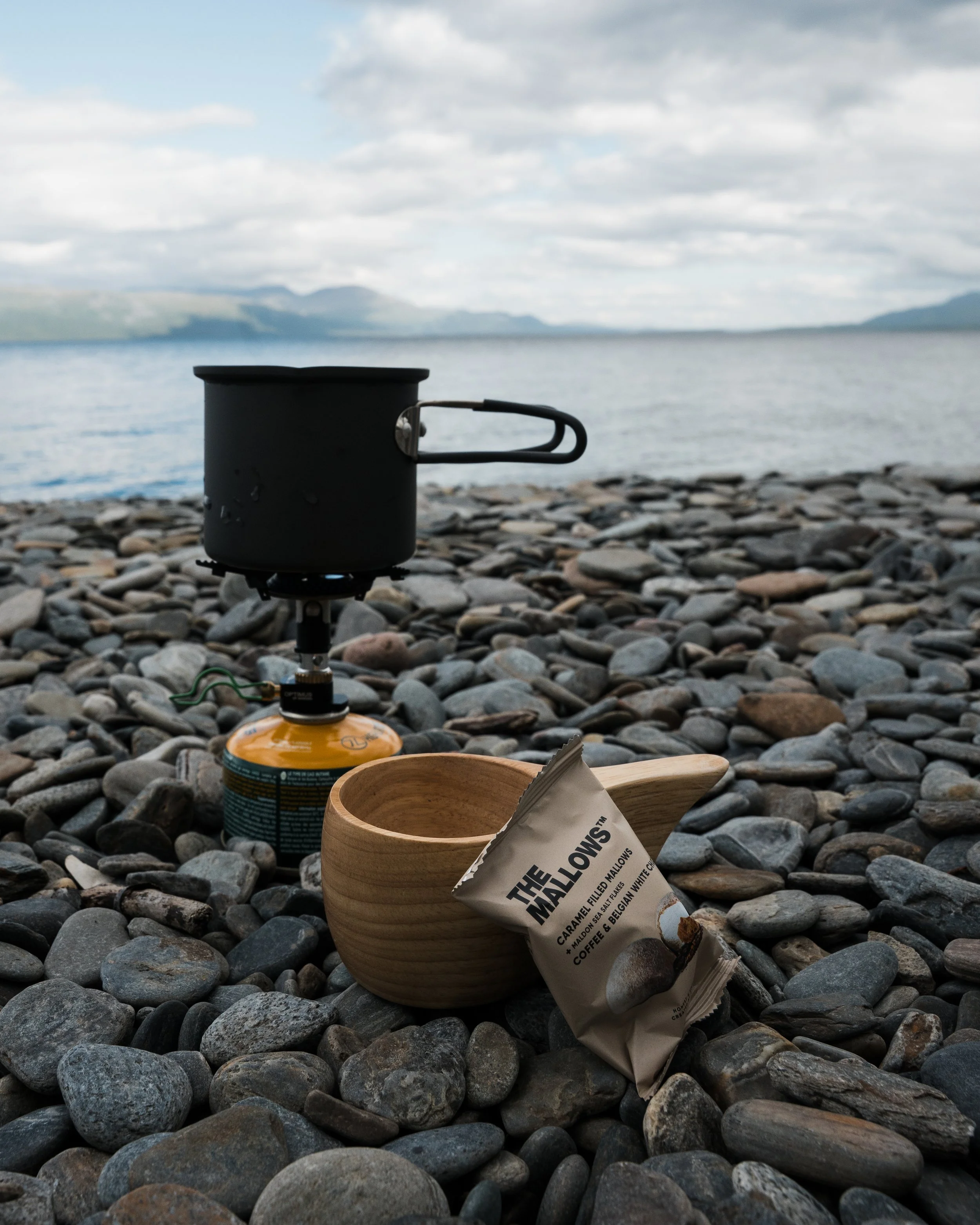A camping scene in Abisko National Park with The Mallows marshmallows on rocks on the beach