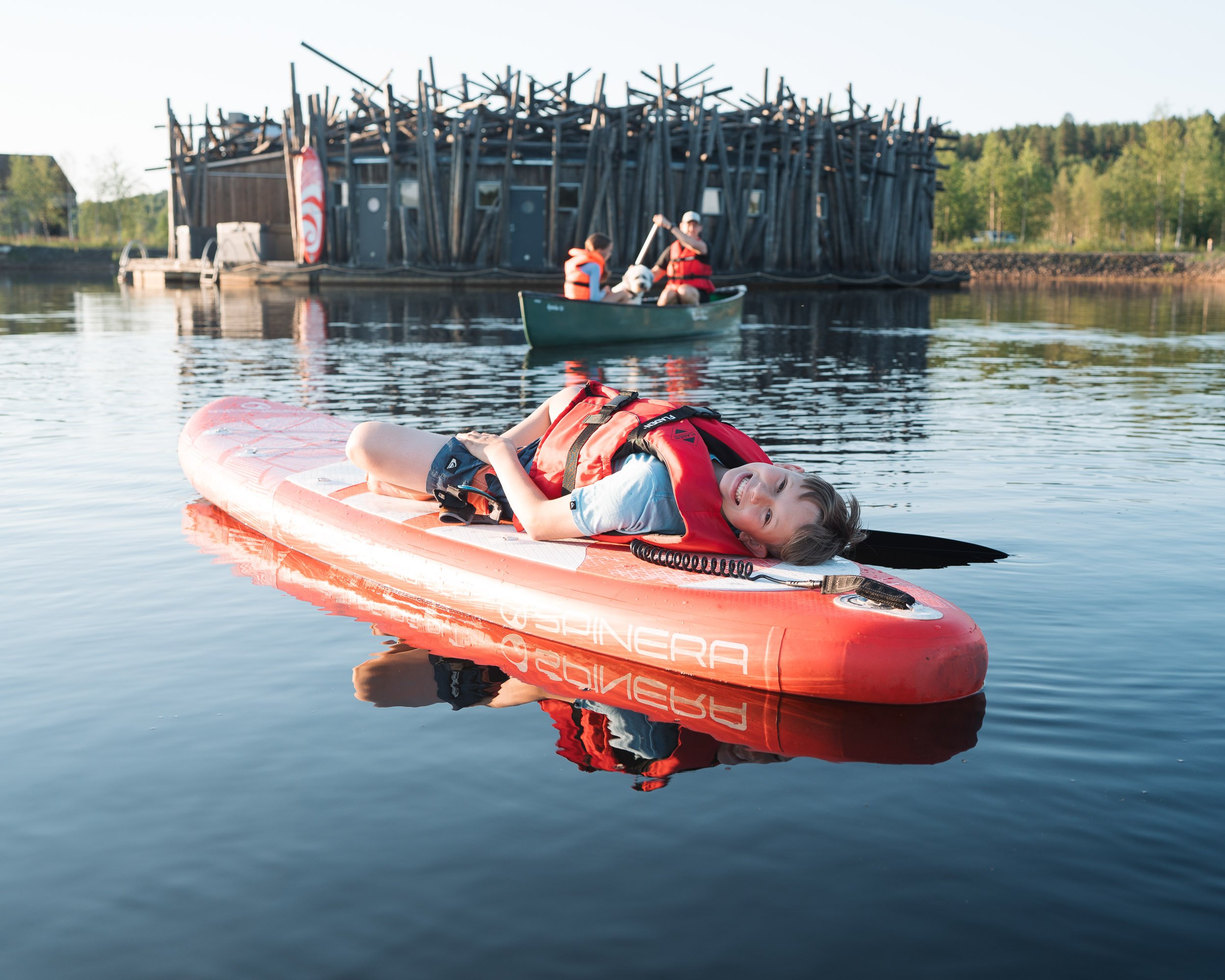 family enjoying water sports at Arctic Bath, Sweden