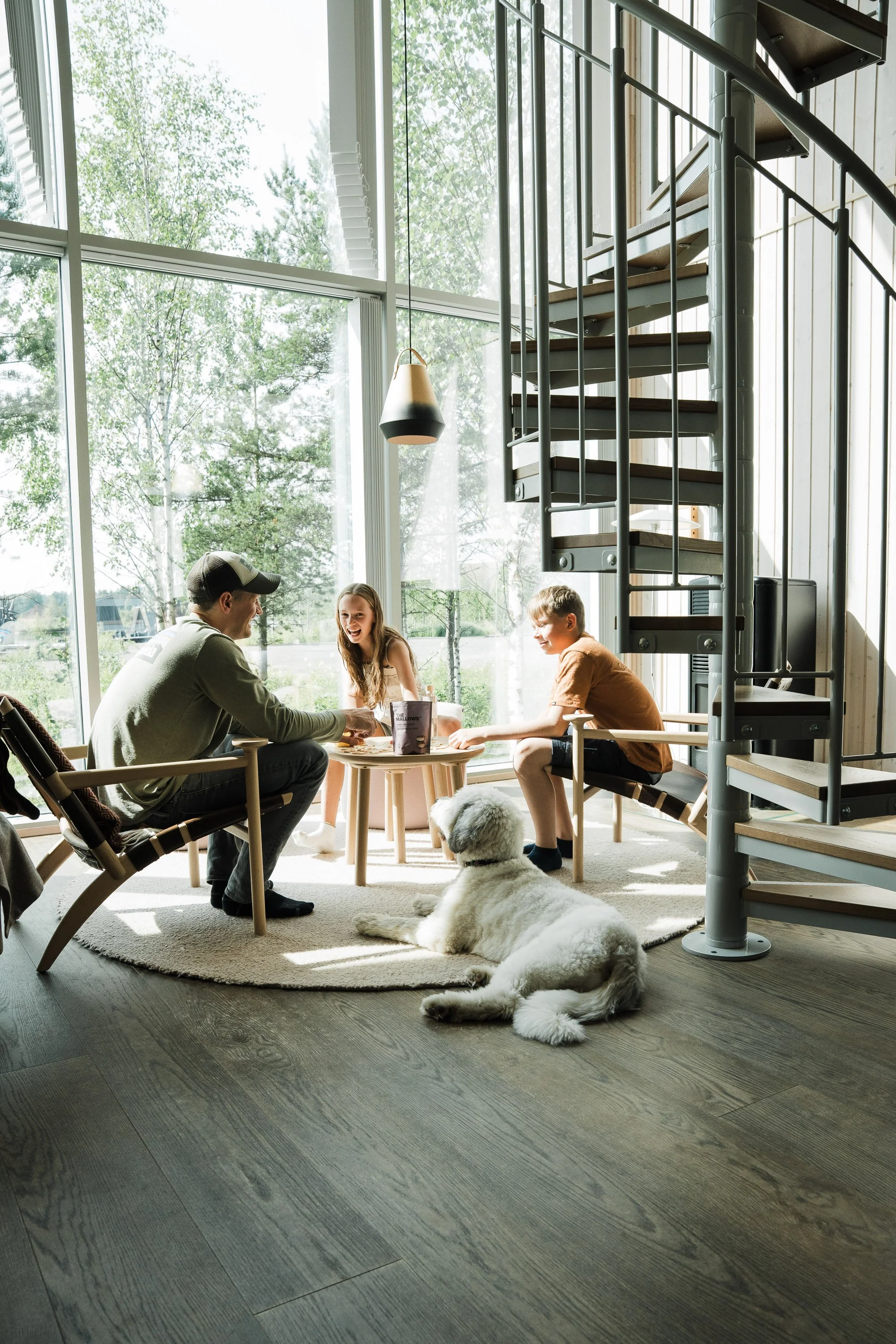 family playing games in the land cabin at Arctic Bath, Sweden, commercial photoshoot 