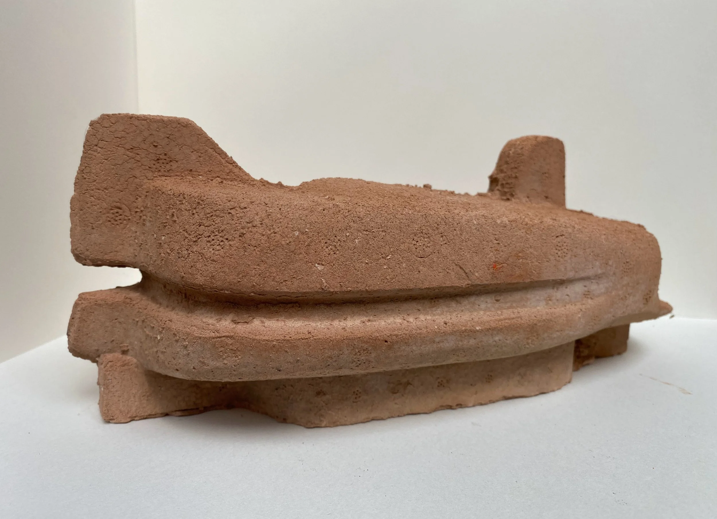 Key Defence
2015
Household wall-plaster cast from discarded keyboard packaging

Discarded keyboard packaging is cast in household wall plaster, converting a protective void into a solid architectural fragment. Once designed to contain technology, the