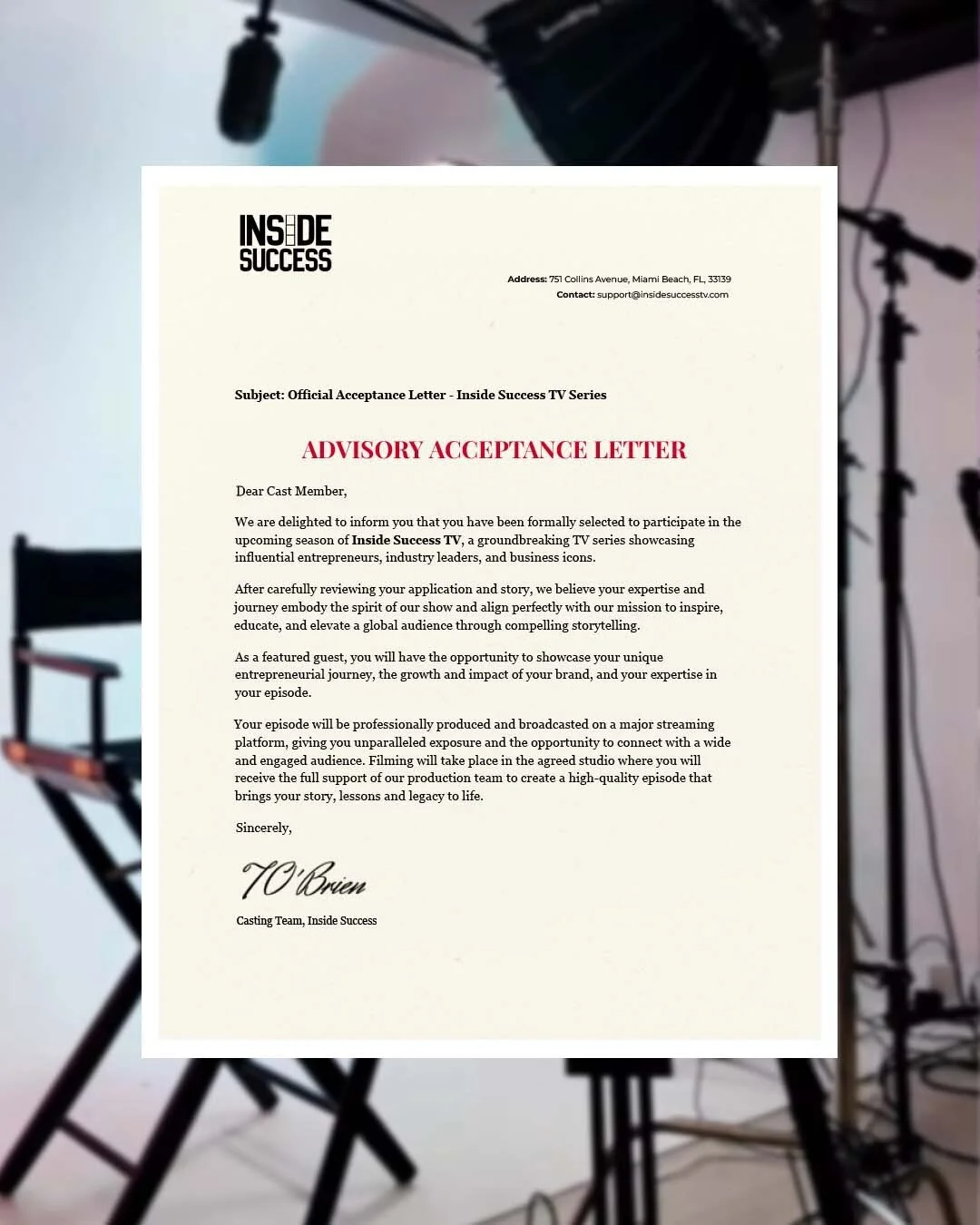A formal acceptance letter from Inside Success TV Series printed on a white sheet of paper, with studio lighting and photography equipment visible in the background.