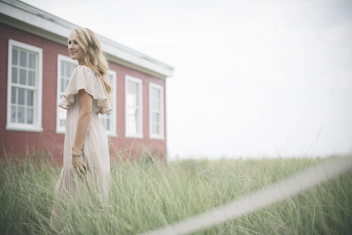 Environmental portrait beside historic Glen Haven building.